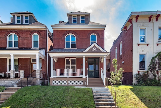 view of front of home featuring a porch and a front lawn