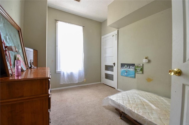 bedroom featuring light colored carpet