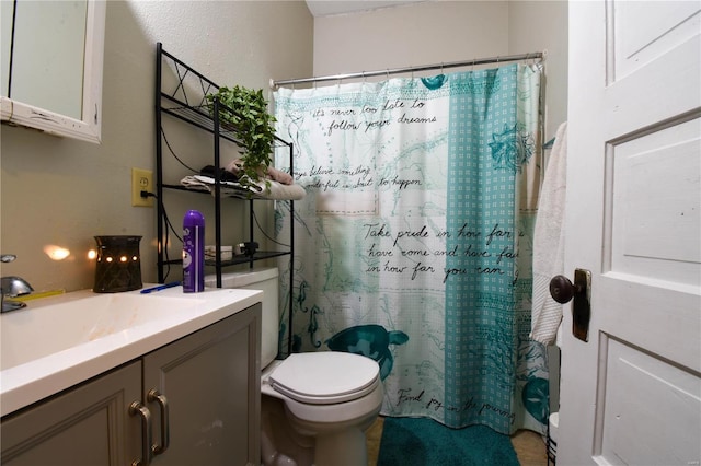 bathroom with vanity, toilet, and a shower with curtain