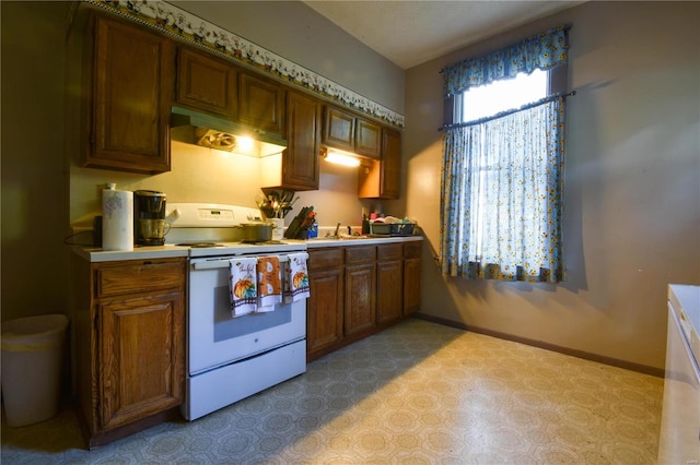 kitchen with sink and white stove