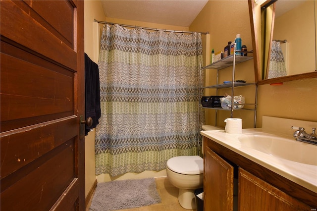 bathroom with tile patterned floors, a shower with curtain, vanity, a textured ceiling, and toilet