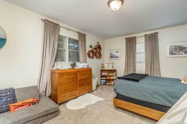 bedroom with light carpet