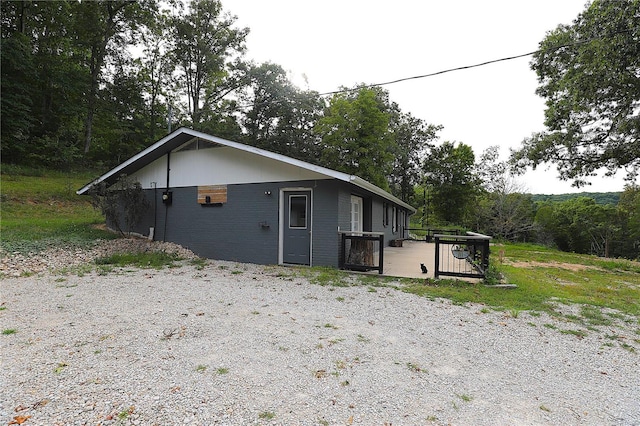 view of home's exterior with a wooden deck