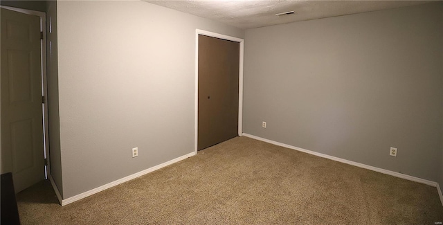 unfurnished room with carpet floors