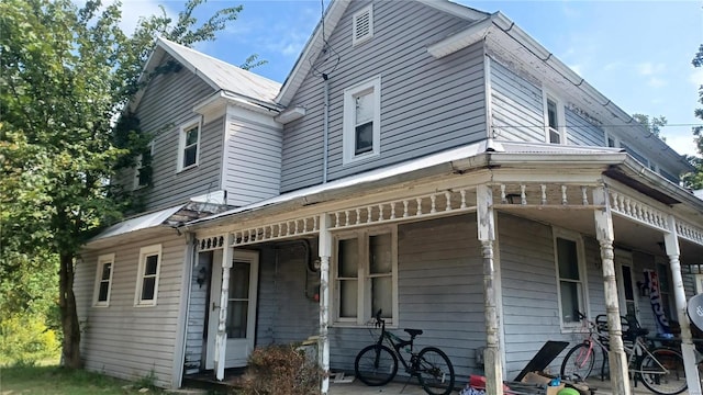 back of house with covered porch