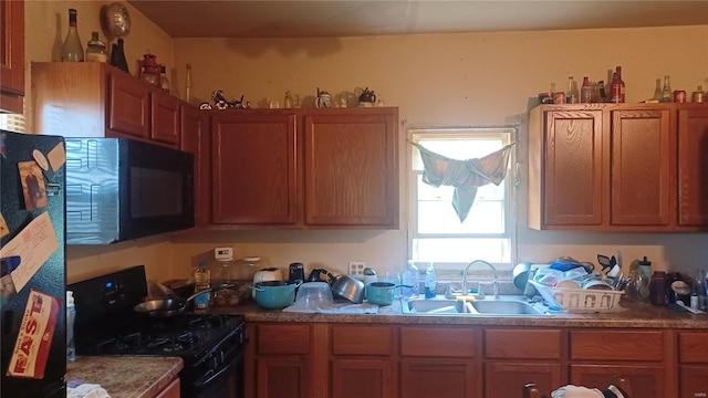 kitchen featuring black appliances and sink