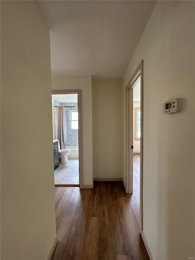 hallway featuring hardwood / wood-style floors