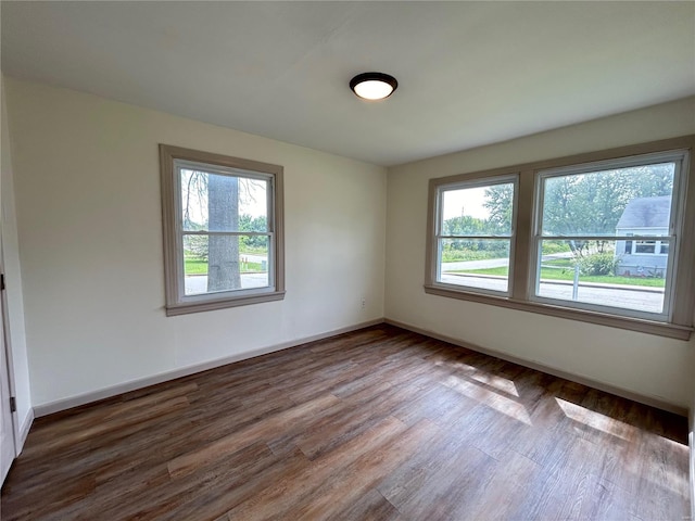 empty room featuring dark hardwood / wood-style flooring