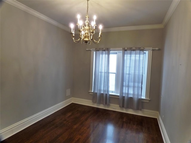 spare room with ornamental molding, hardwood / wood-style floors, and a notable chandelier