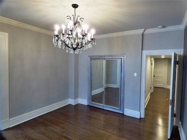 interior space with crown molding, a chandelier, and dark hardwood / wood-style floors