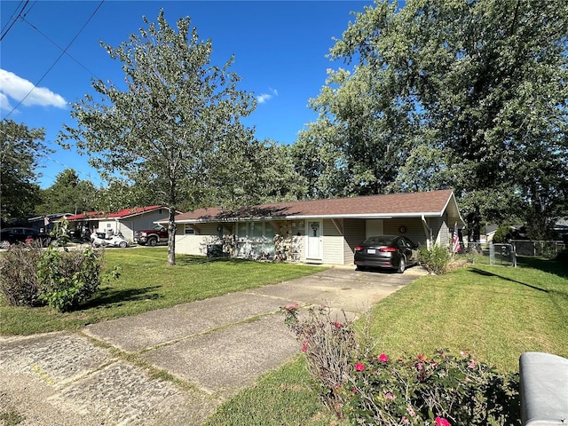 view of front of property featuring a carport and a front lawn