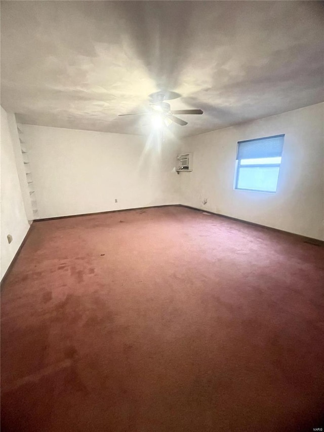 interior space with a wall mounted AC, ceiling fan, and carpet