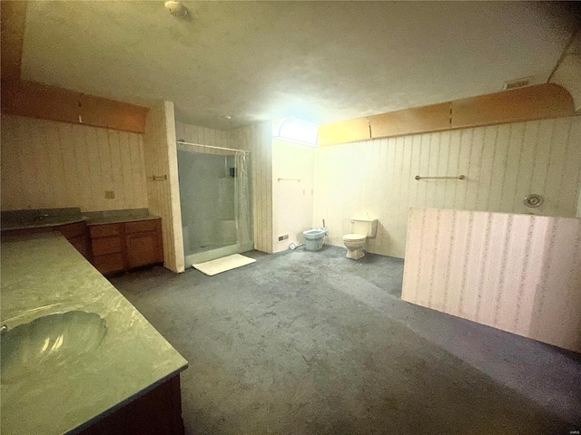 bathroom featuring walk in shower, toilet, a bidet, and vanity