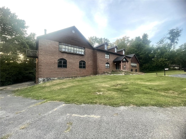 view of home's exterior with a yard