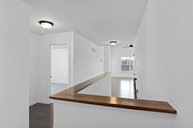 corridor with dark wood-type flooring