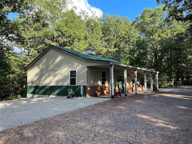 view of front of home with a carport