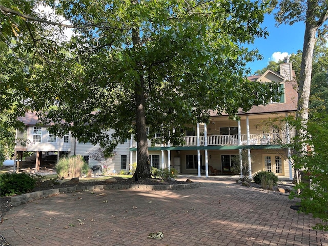 view of front of house featuring a balcony