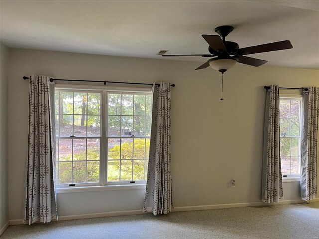 spare room with ceiling fan and carpet flooring