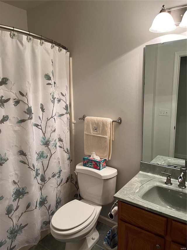 bathroom with vanity, tile patterned flooring, toilet, and a shower with curtain