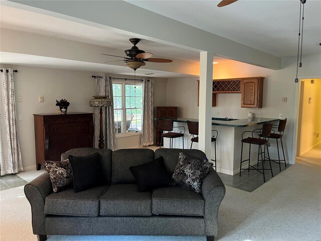 living room with ceiling fan and light carpet