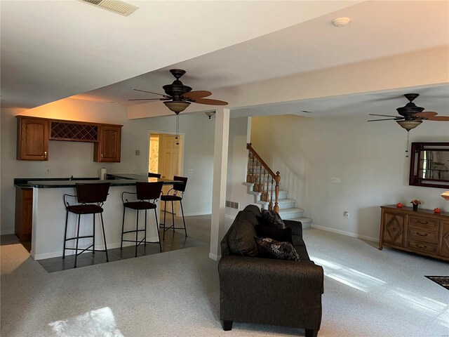 living room with ceiling fan