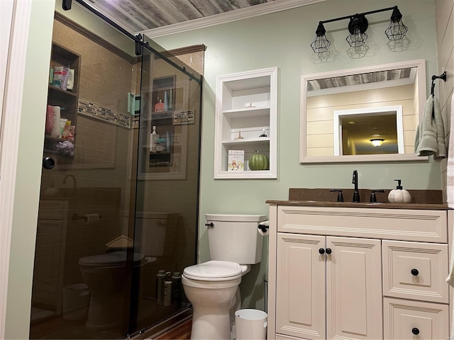 bathroom featuring vanity, a shower with shower door, toilet, and crown molding