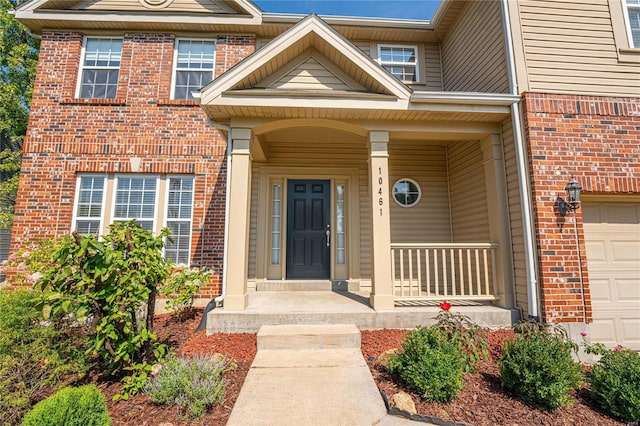 property entrance featuring a porch and a garage