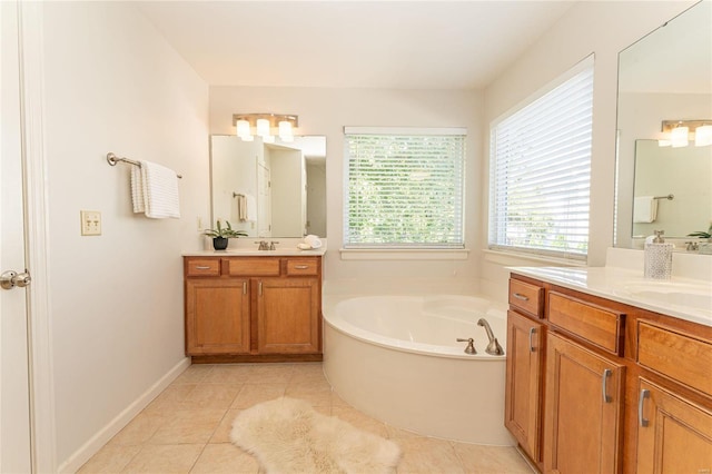 bathroom with vanity, a tub to relax in, and tile patterned floors