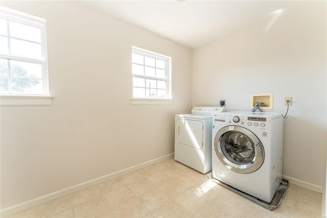 washroom featuring separate washer and dryer and plenty of natural light