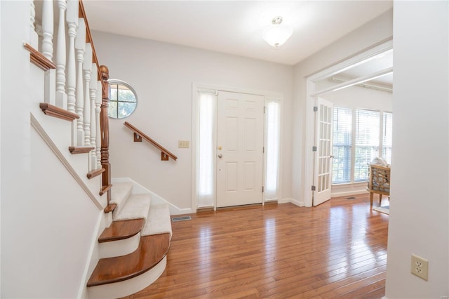 entryway with hardwood / wood-style floors