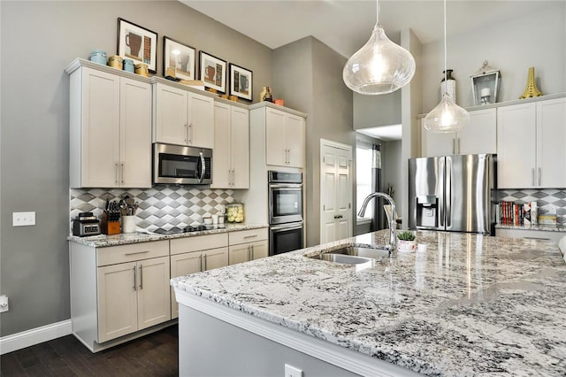 kitchen featuring sink, dark hardwood / wood-style floors, appliances with stainless steel finishes, and white cabinetry