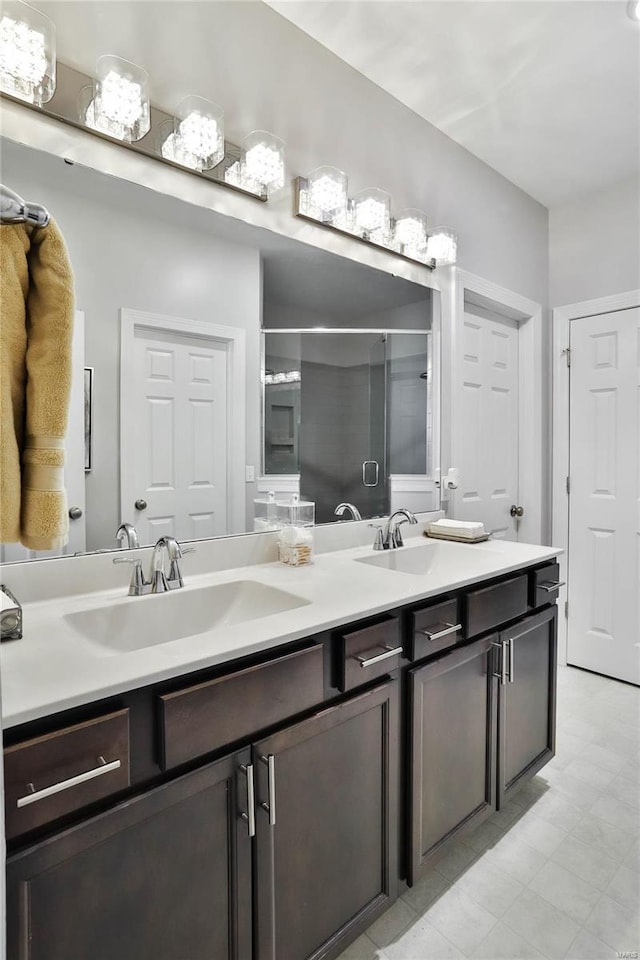 bathroom with walk in shower and vanity