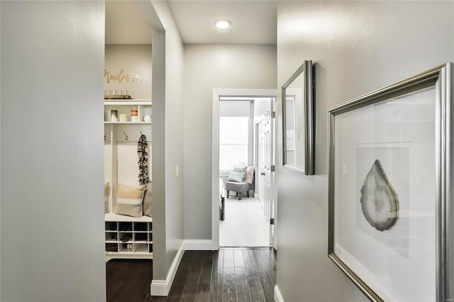 corridor with dark hardwood / wood-style floors