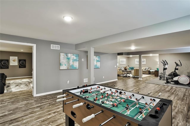 game room with hardwood / wood-style flooring