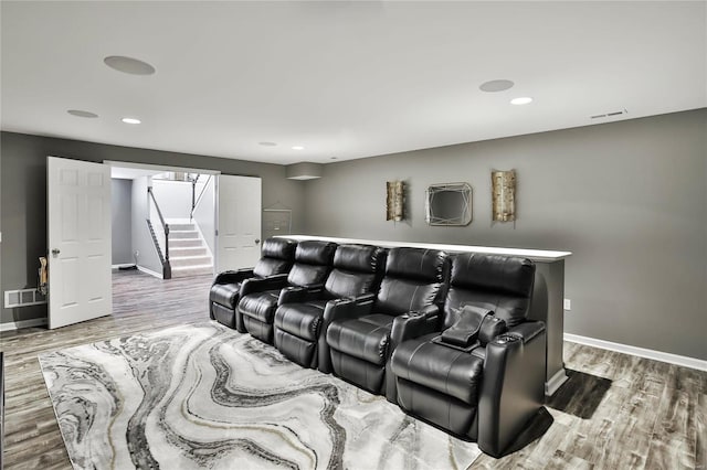 home theater room featuring wood-type flooring