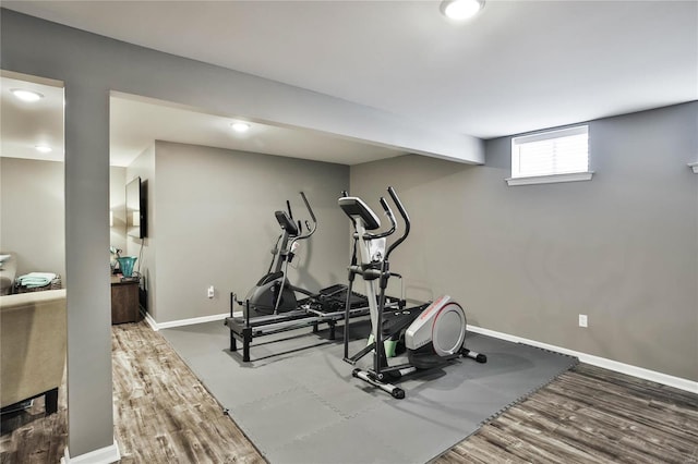 exercise room featuring hardwood / wood-style floors