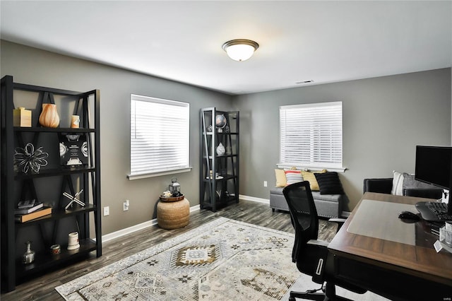 office space with dark hardwood / wood-style flooring