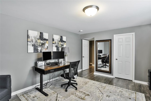 office space featuring dark wood-type flooring