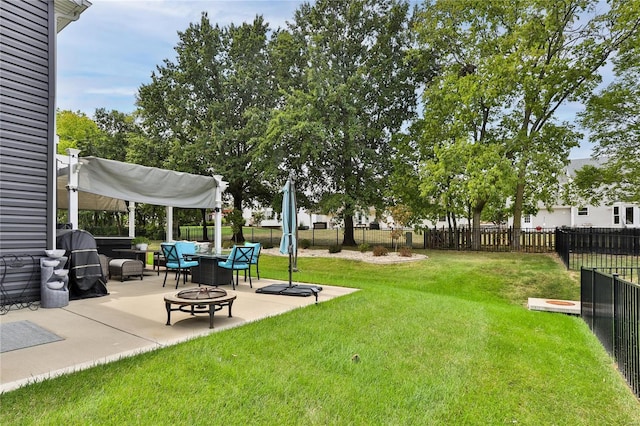 view of yard featuring a fire pit and a patio area