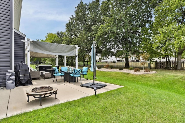 view of yard with a fire pit and a patio area