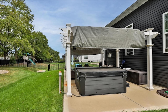 view of patio / terrace featuring a playground and a hot tub