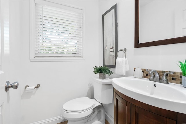 bathroom featuring toilet and vanity