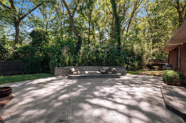 view of patio featuring grilling area and a fire pit