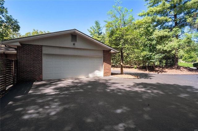 view of side of property featuring a garage