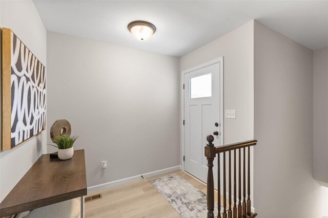 foyer with light hardwood / wood-style flooring