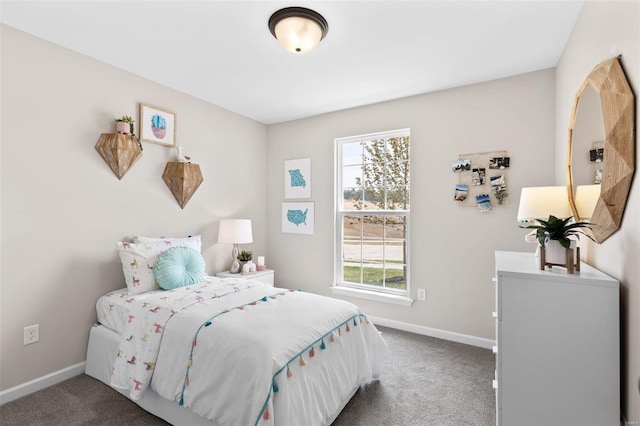 carpeted bedroom with baseboards