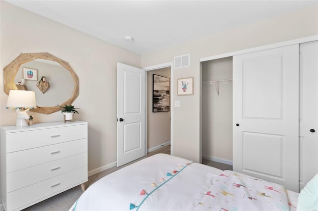 carpeted bedroom featuring a closet