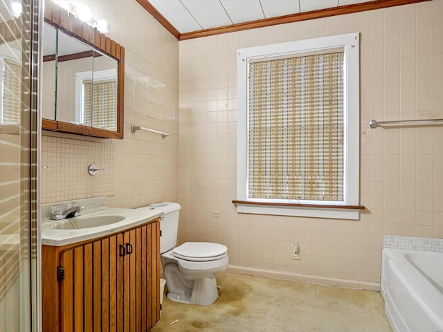 bathroom with crown molding, toilet, tile walls, a washtub, and vanity