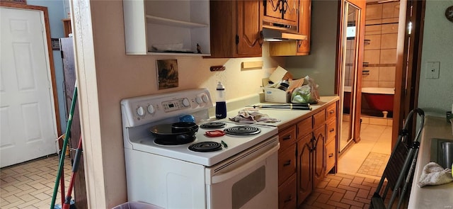 kitchen with white electric stove and extractor fan