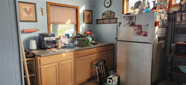 kitchen with stainless steel refrigerator